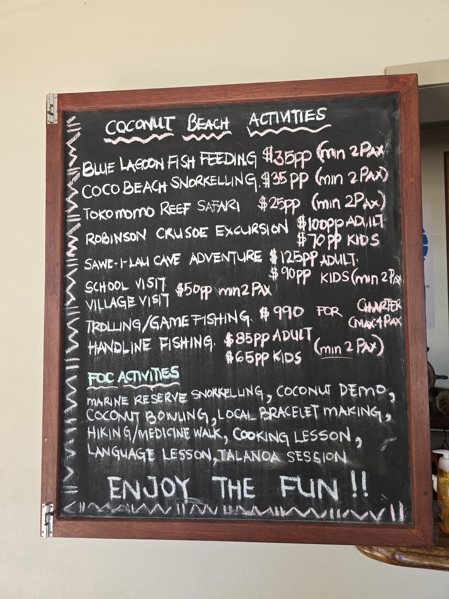 A chalkboard listing the day's island activities at a Yasawa resort