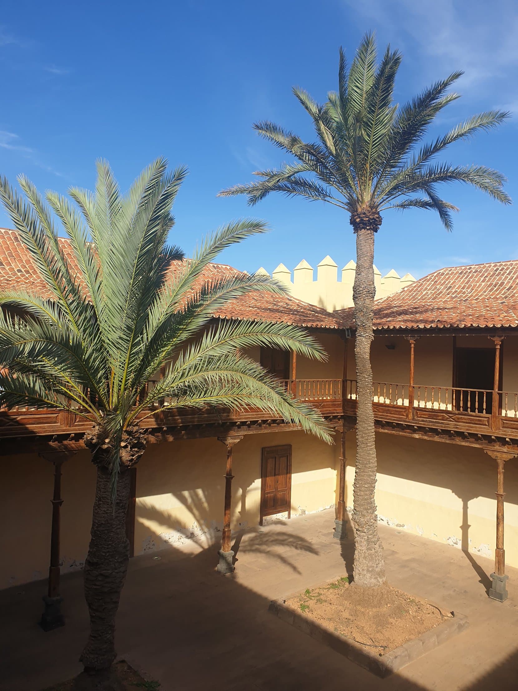 Palms over a colonial courtyard in Betancuria, Fuerteventura