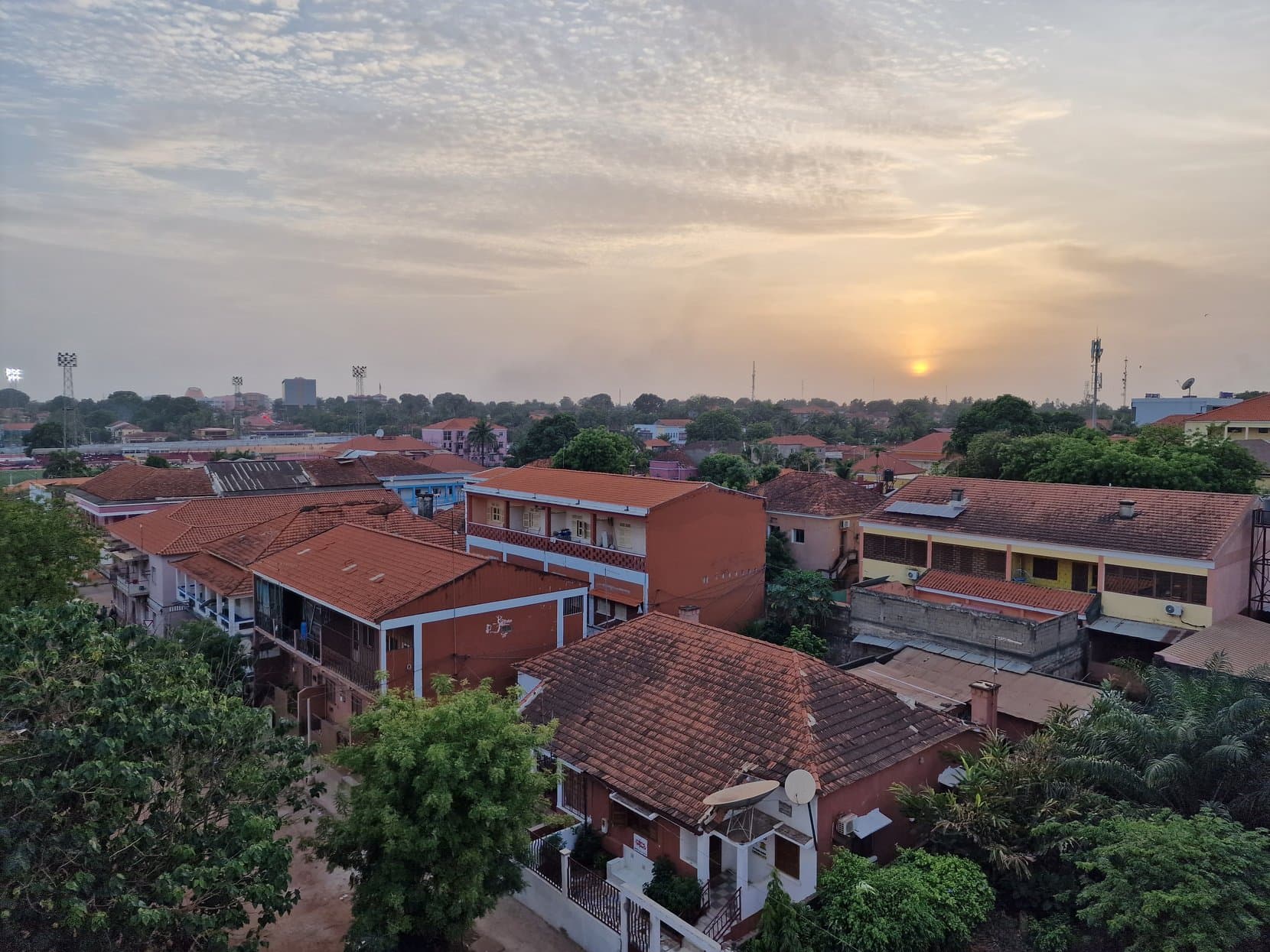 Bissau's red-tiled rooftops at sunset
