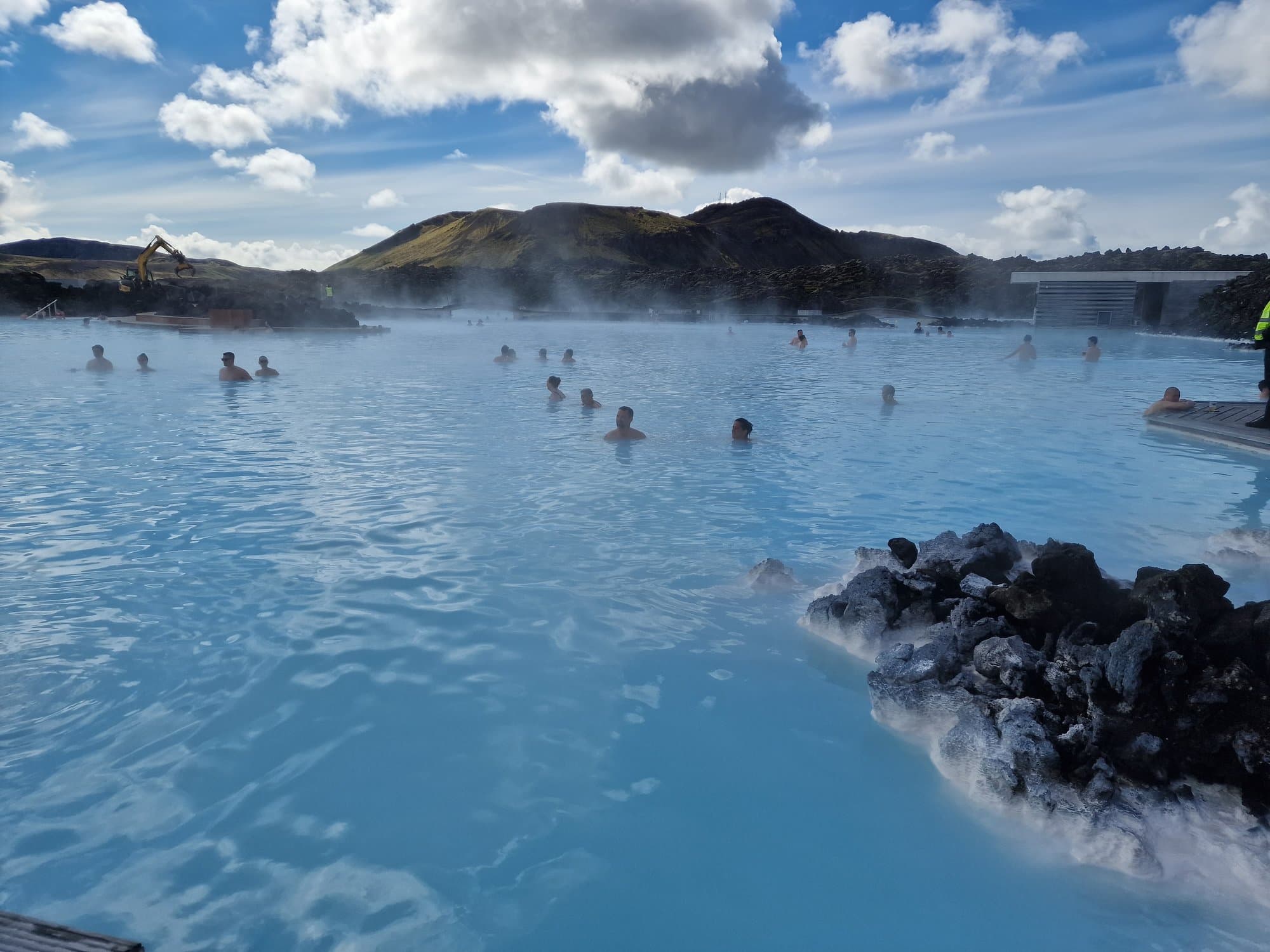 Bathers in the pale blue geothermal water of the Blue Lagoon, Reykjanes
