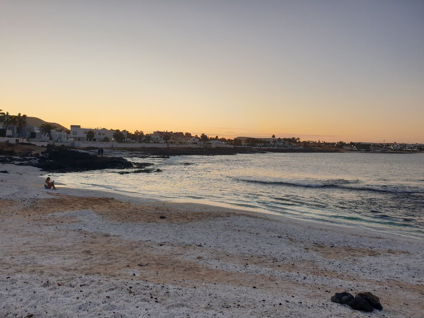 A shallow lagoon on the Corralejo shore at dusk, Fuerteventura