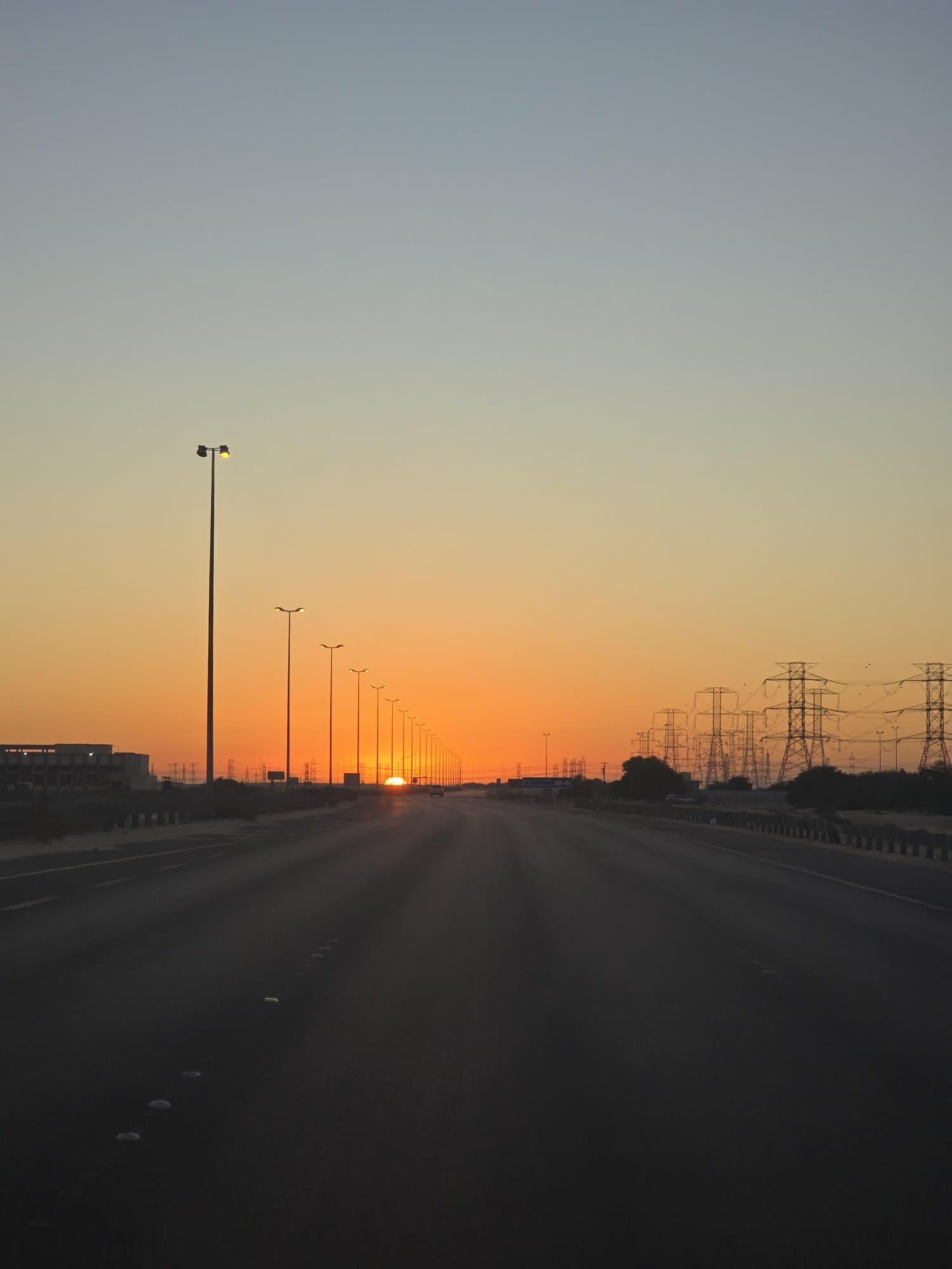 Sunset over the desert highway north of the bay