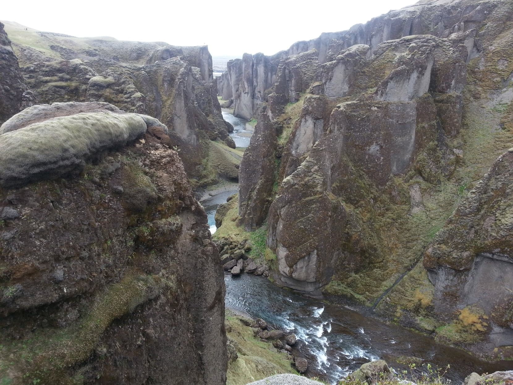 The river winding between the mossy walls of Fjaðrárgljúfur canyon