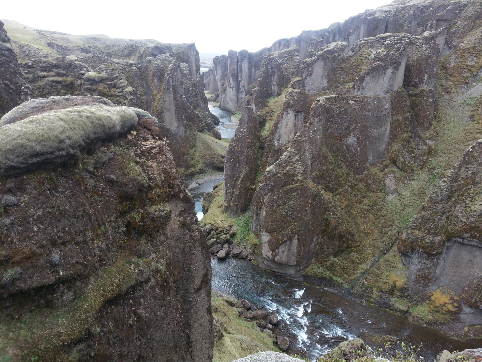 The river winding between the mossy walls of Fjaðrárgljúfur canyon