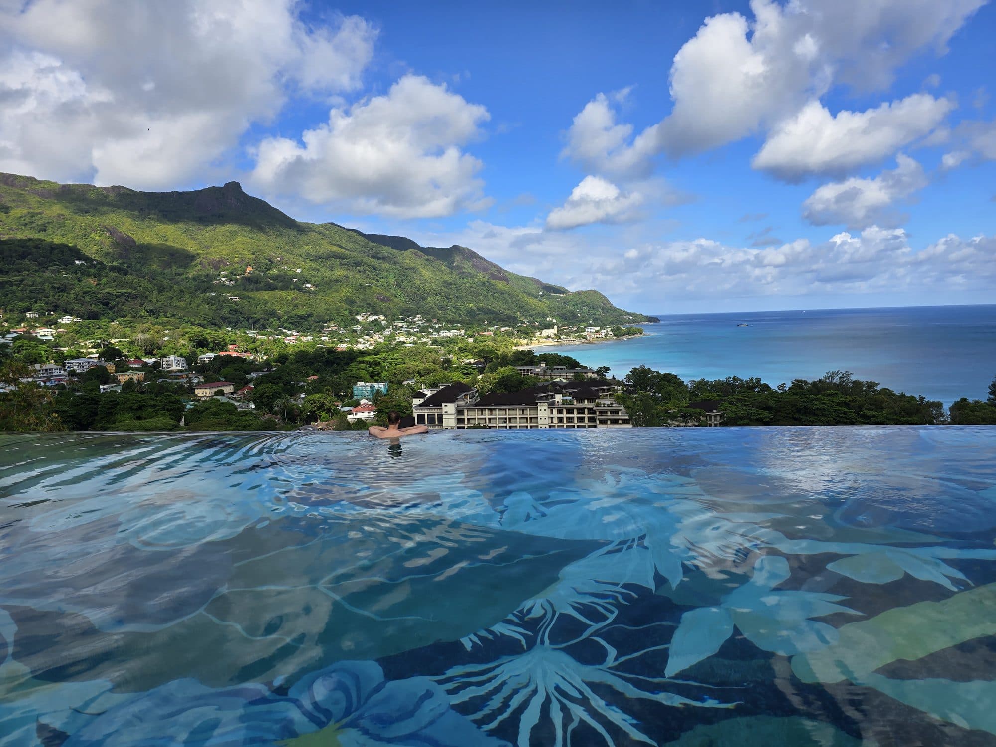 Infinity pool looking out over Beau Vallon bay and the mountains of Mahé, Seychelles