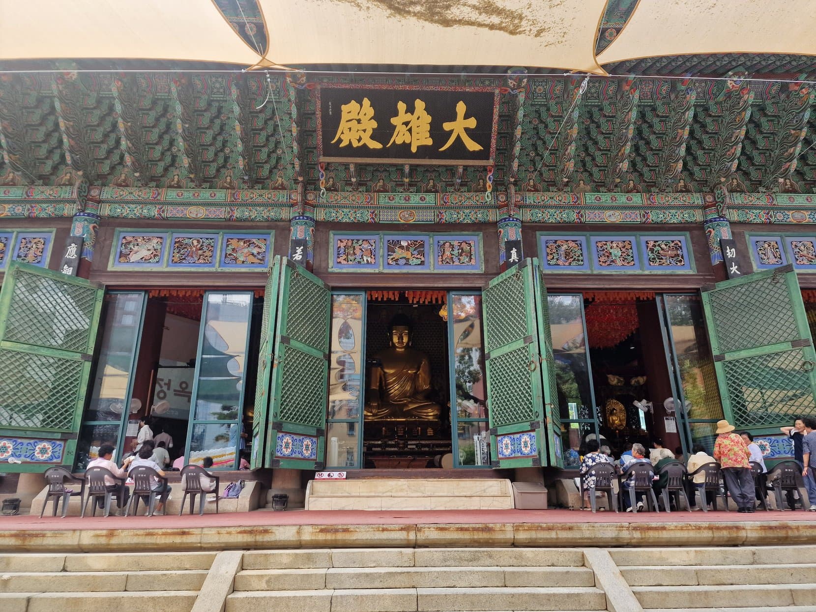 The main hall of Jogyesa temple under rows of coloured lanterns, Seoul