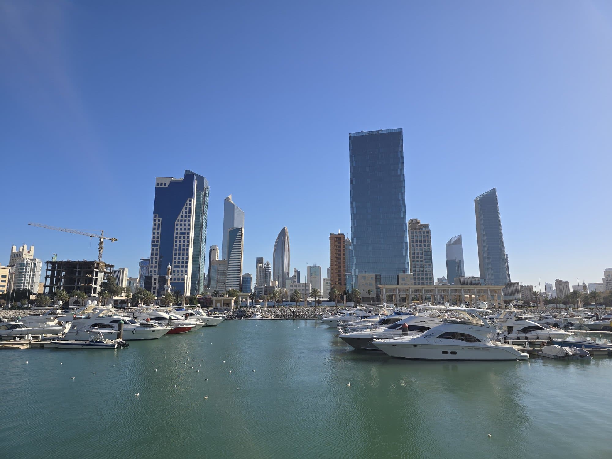 Yachts at Souq Sharq marina with the skyline behind
