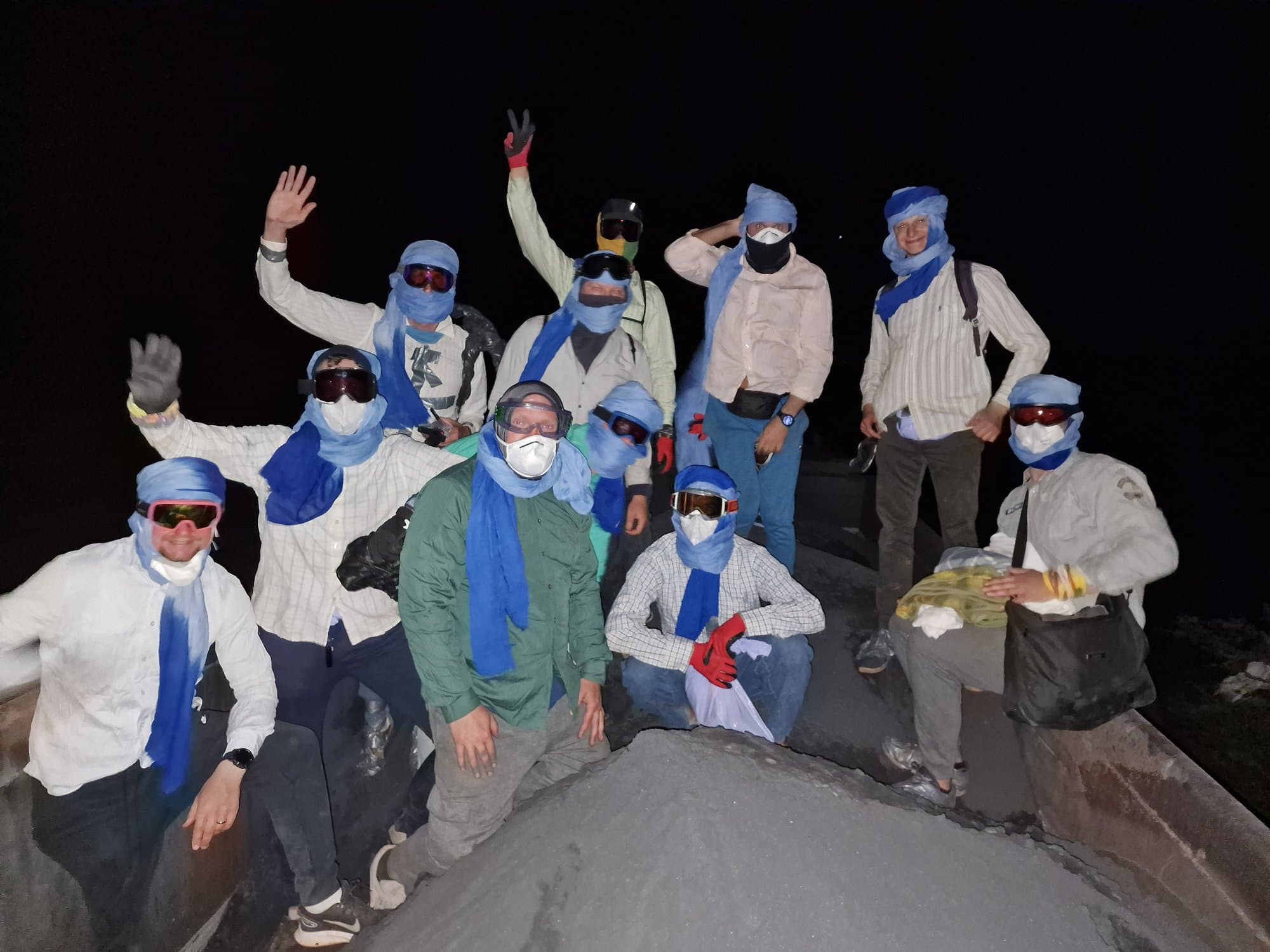 The group lying on the iron ore inside a wagon at night