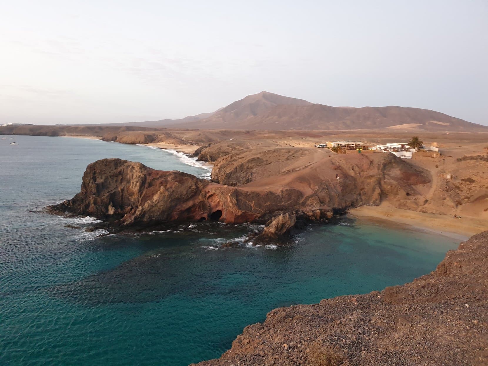 The Papagayo headland and its turquoise cove under bare hills, Lanzarote