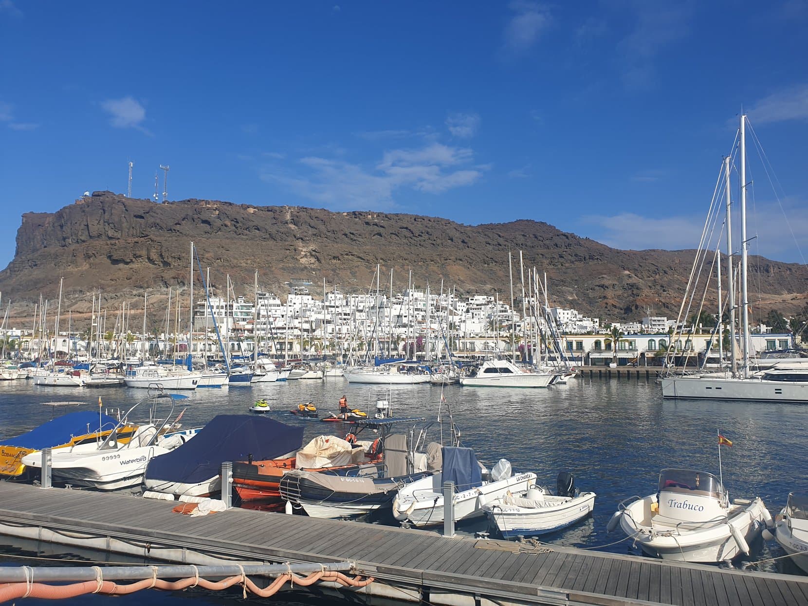 Sailboats in the marina of Puerto de Mogán under its headland, Gran Canaria