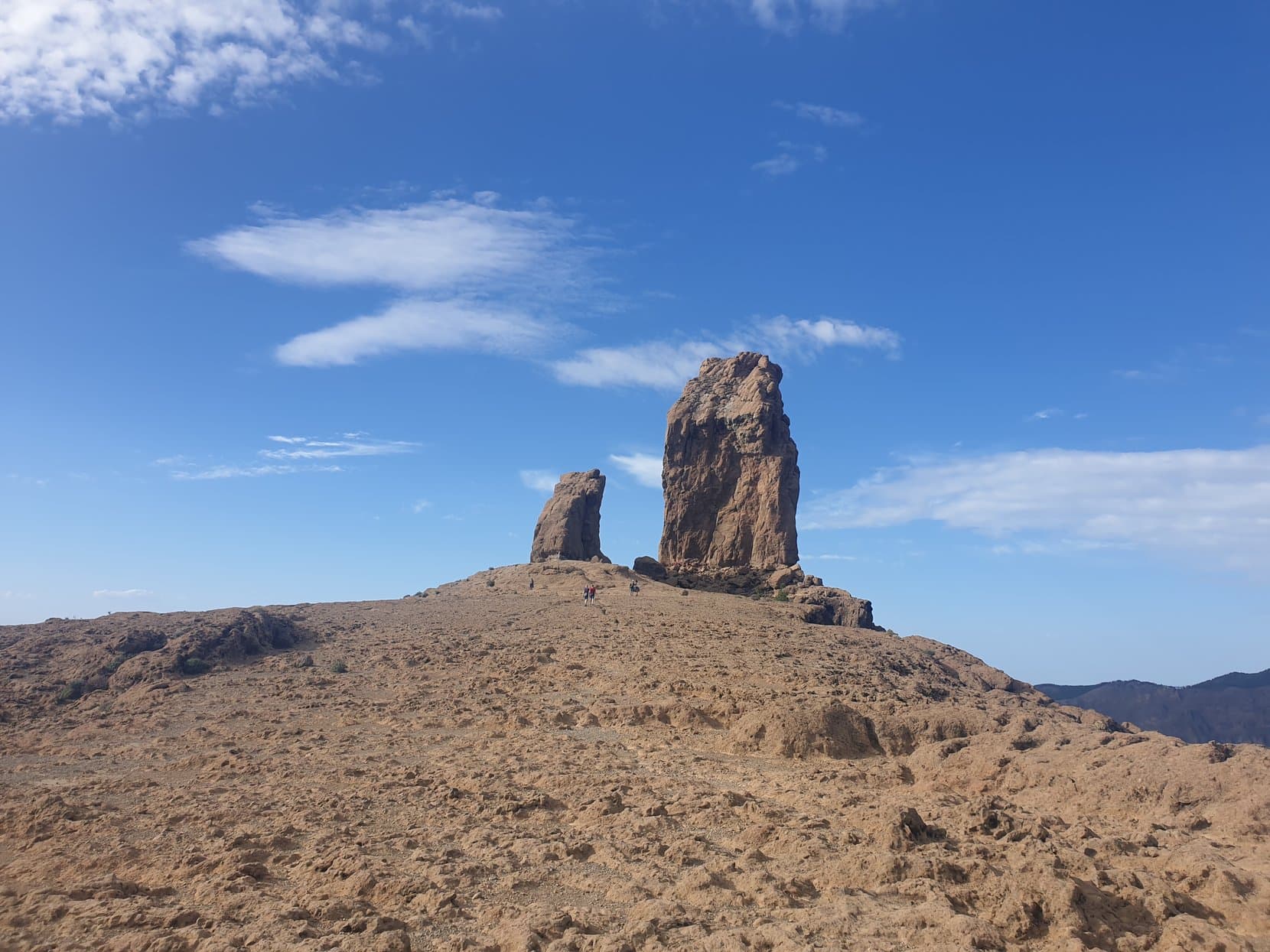 Roque Nublo and El Fraile standing over the bare summit plateau, Gran Canaria