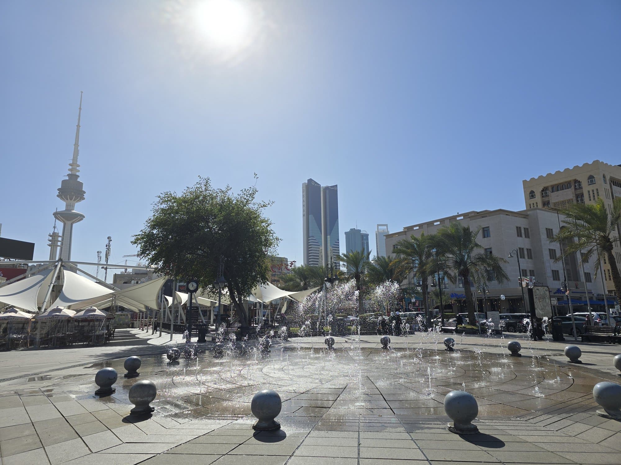 The fountains of Safat Square with the Liberation Tower behind