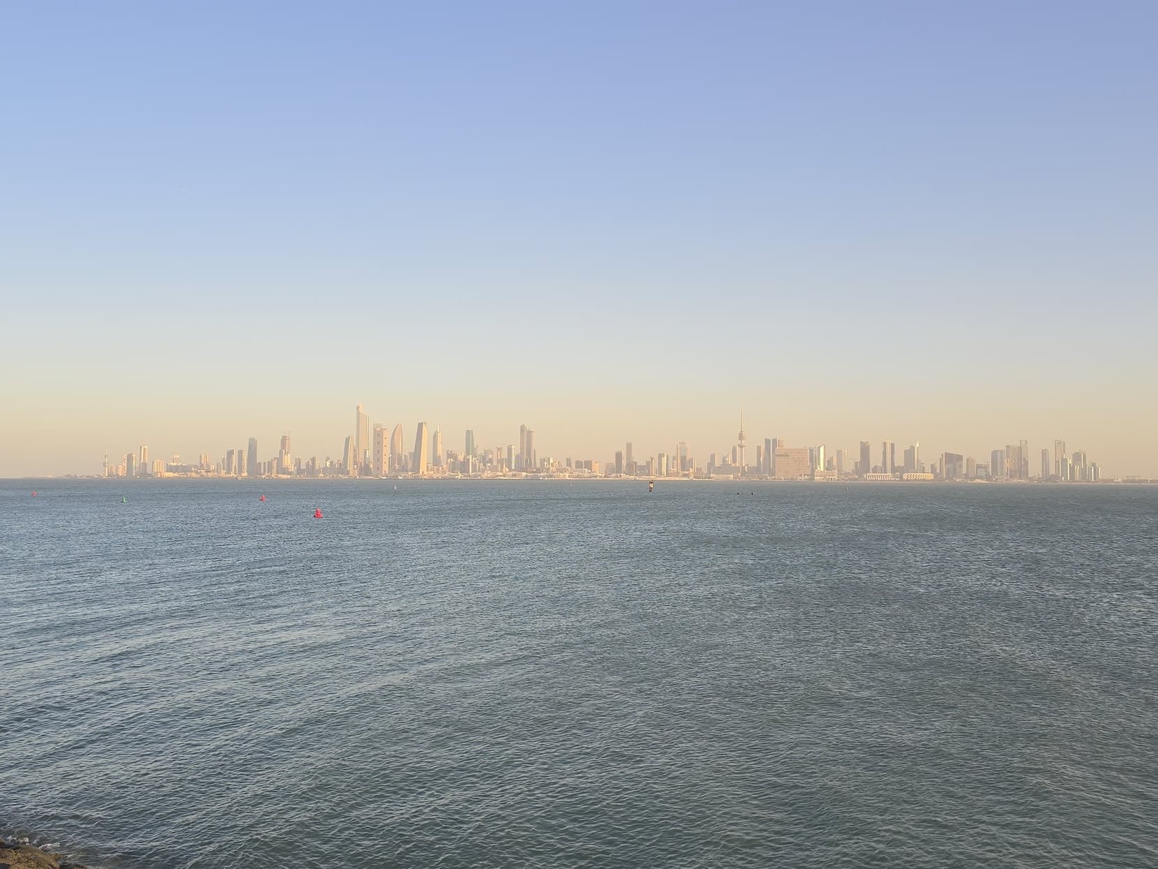 The Kuwait City skyline across the water from the causeway