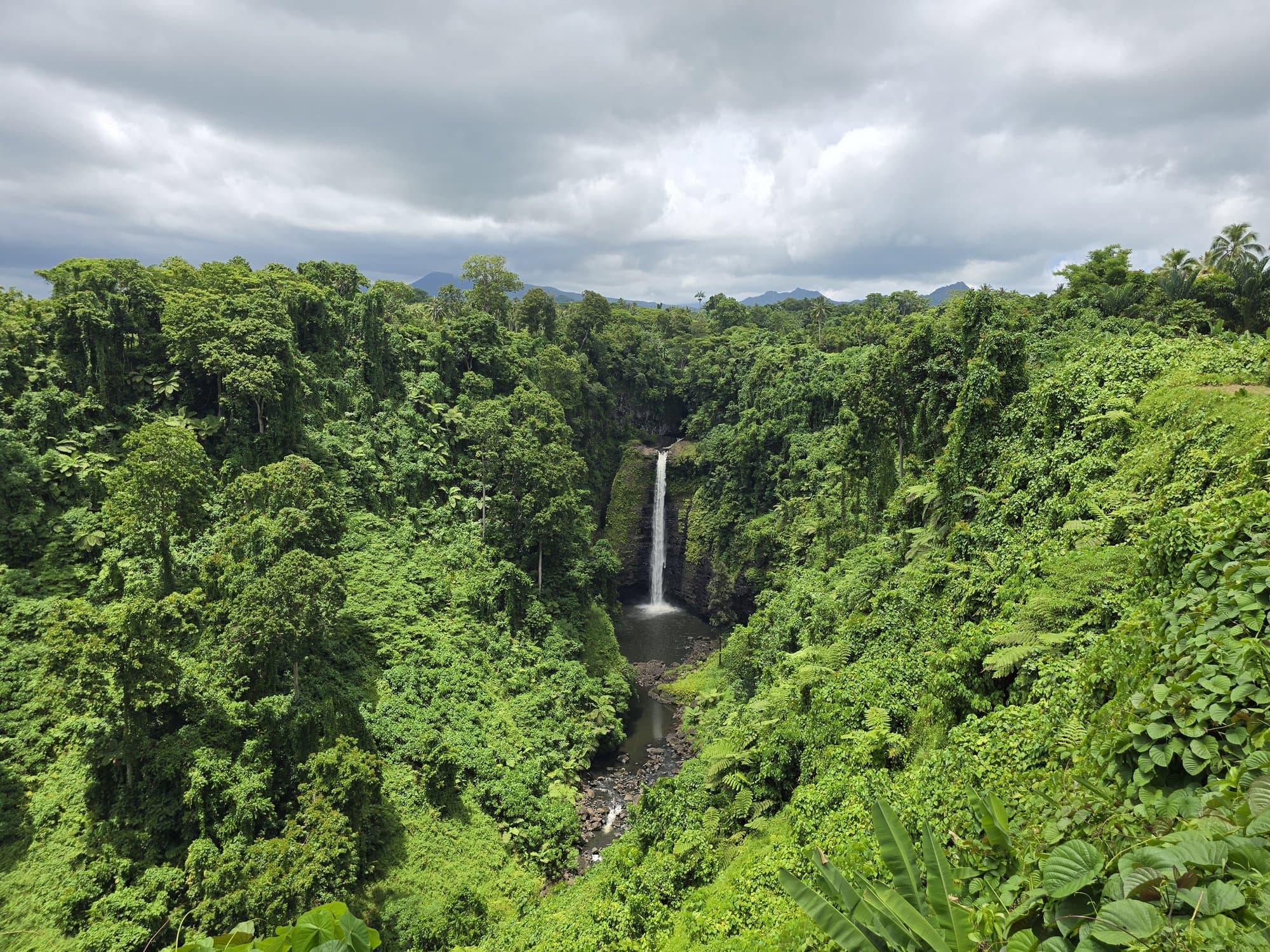 Sopo'aga Falls dropping into a green jungle gorge on Upolu