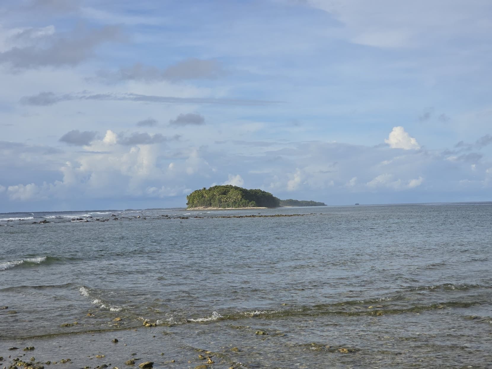 The tree-topped islet off the southern tip of Fongafale across the shallows