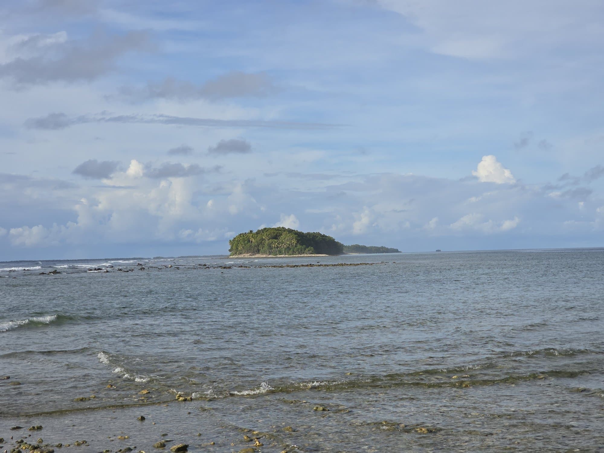 The tree-topped islet off the southern tip of Fongafale across the shallows