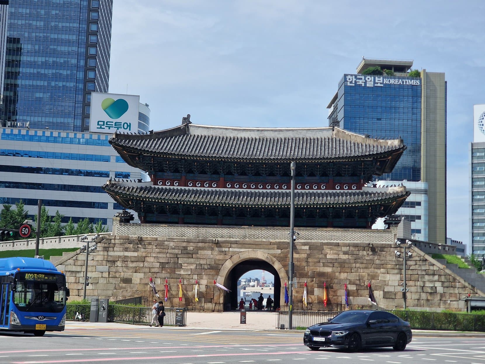Sungnyemun, the old south gate of Seoul, boxed in by glass office towers