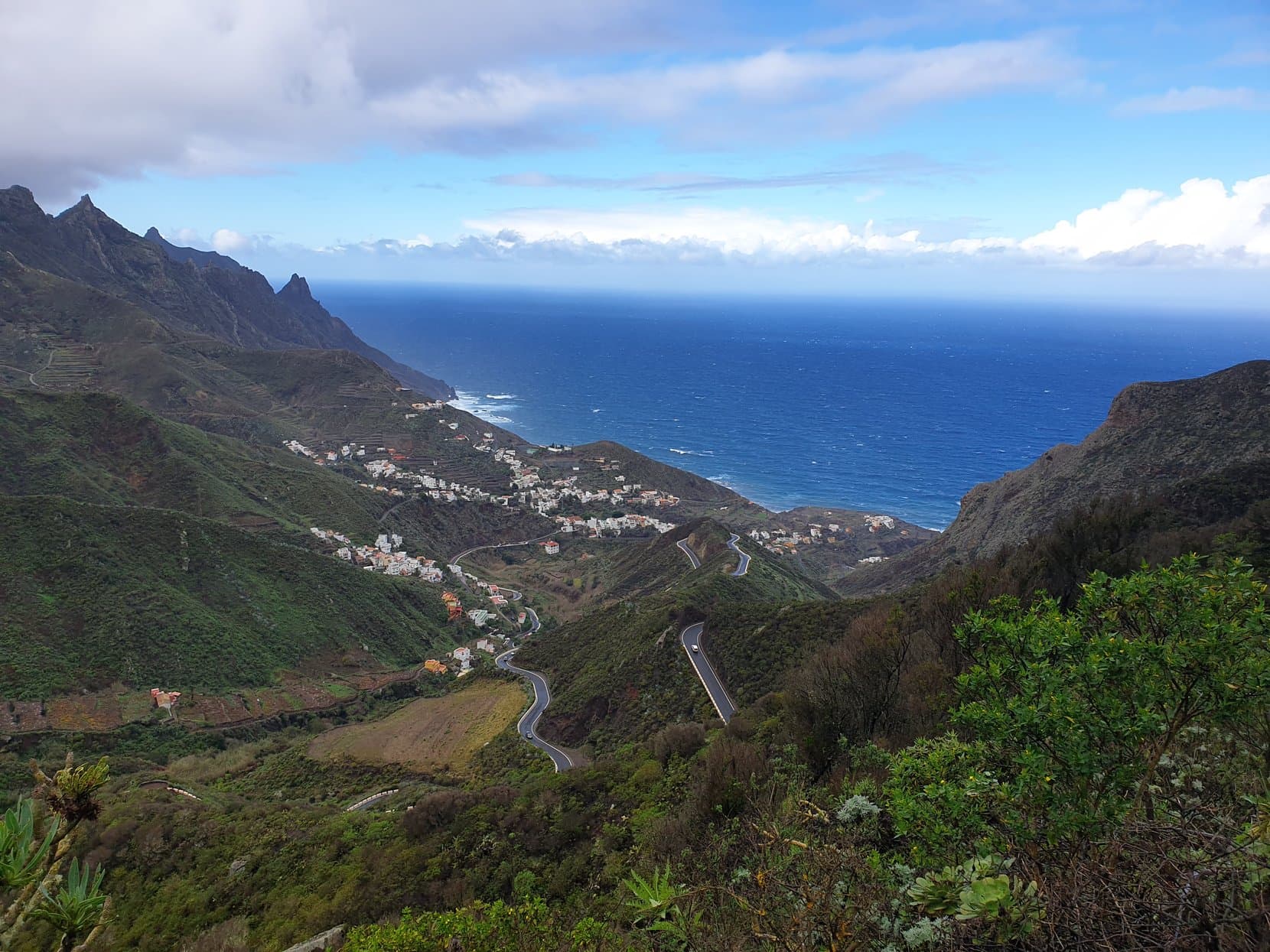 The green ridges of the Anaga mountains dropping to Taganana's villages and a deep blue sea, Tenerife