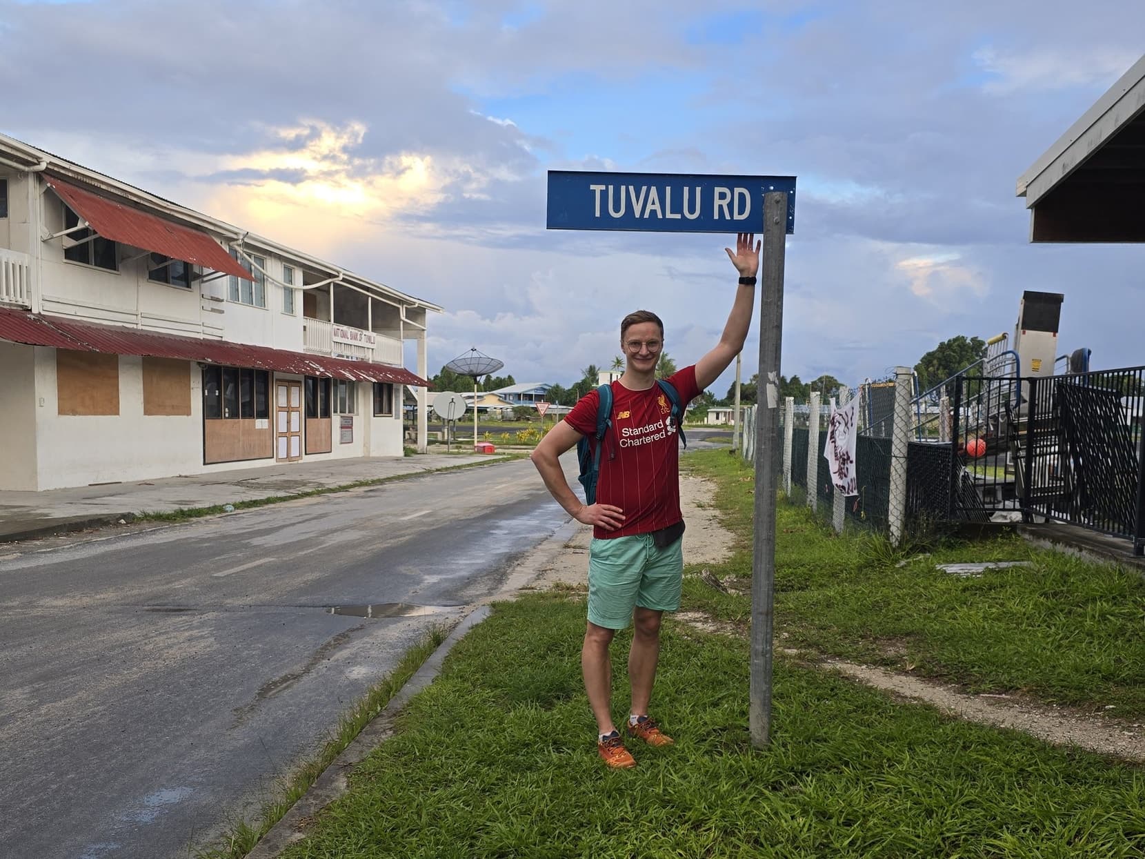 Standing at the TUVALU RD street sign in Vaiaku at dusk