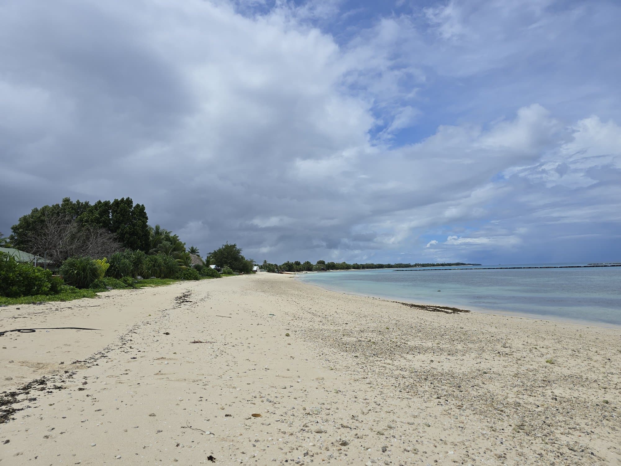The white sand spit north of the village, wide and empty