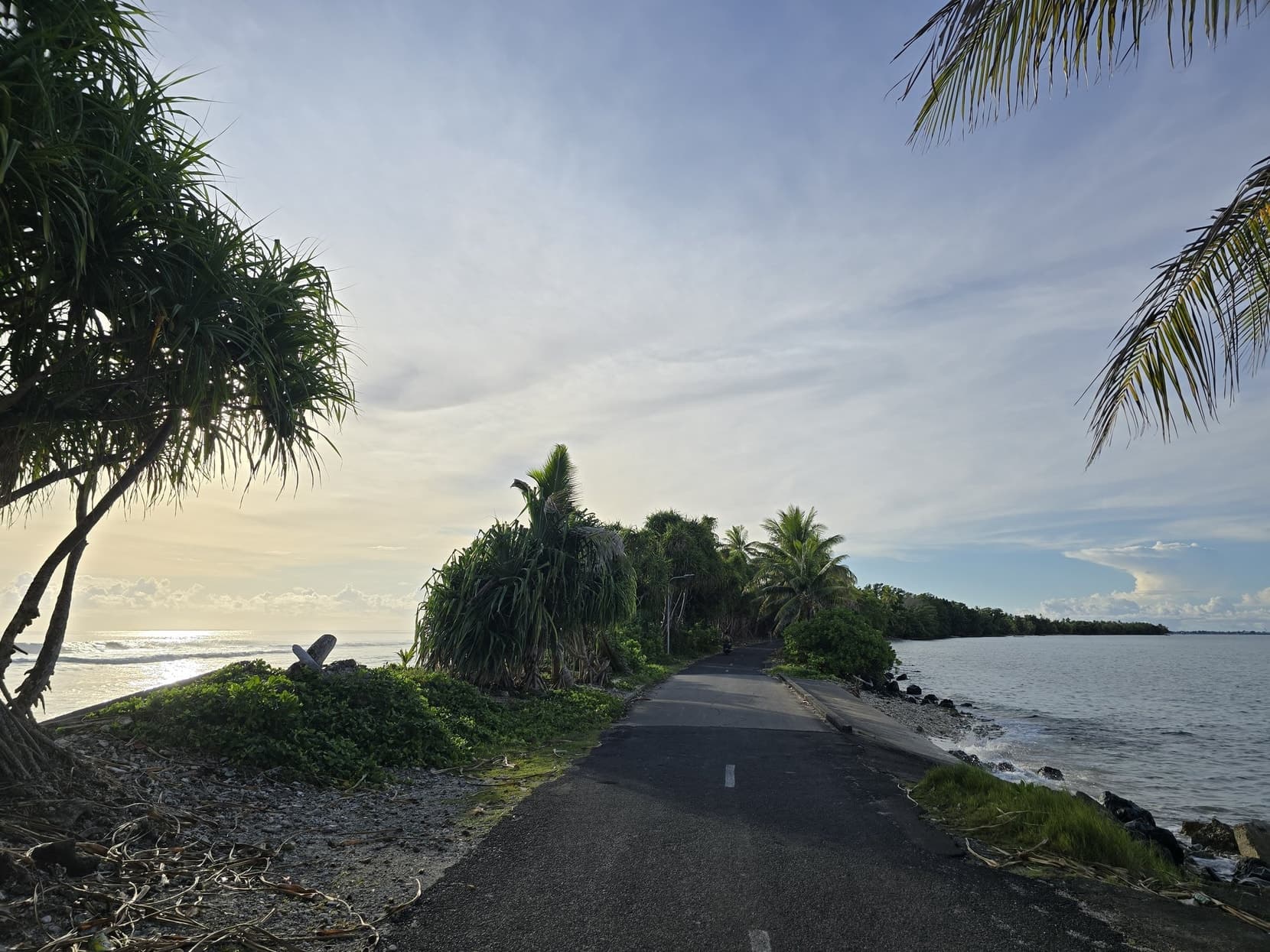 The road at Fongafale's narrowest point with the lagoon and the open Pacific on either side