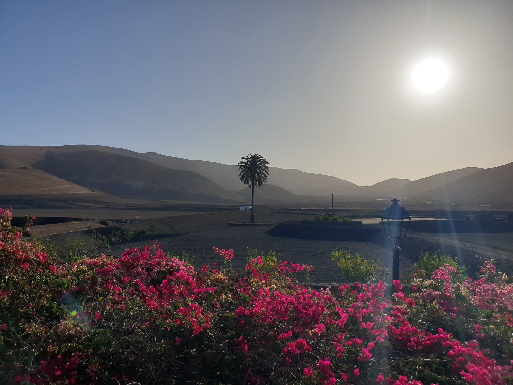 The sun setting into the sea over a Papagayo cove, Lanzarote